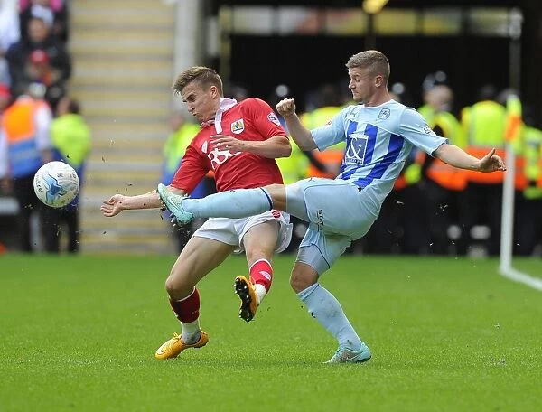 Battling for Control: Joe Bryan vs. Aaron Phillips in Sky Bet League One Clash at Ricoh Arena