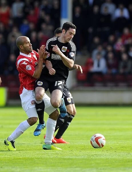 Battling for Supremacy: Greg Cunningham vs. Adam Chambers in Walsall vs. Bristol City Football Match, April 2014