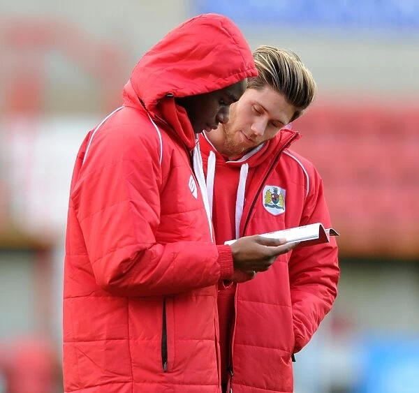 Bristol City Duo Wes Burns and Jordan Wynter Reviewing Match Program Before Swindon Town Clash, 15th November 2014
