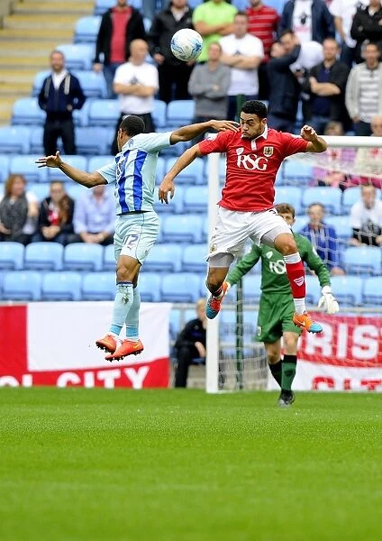 Bristol City vs Coventry City: Intense Aerial Battle Between Derrick Williams and Simeon Jackson