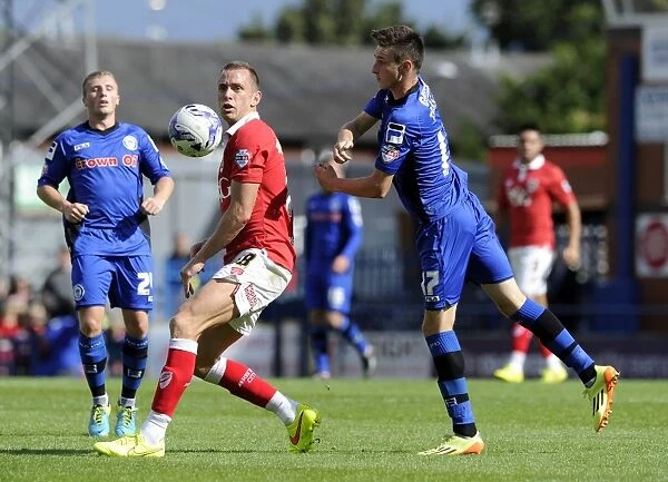 Bristol City vs Rochdale: Wilbraham and Tanser Battle for Ball in Sky Bet League One Clash