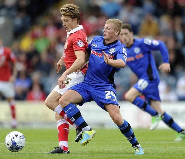Bristol City's Luke Freeman Faces Off Against Rochdale's Jamie Allen in Sky Bet League One Clash