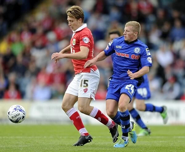 Bristol City's Luke Freeman vs Rochdale's Jamie Allen: Intense Moment in Rochdale v Bristol City Football Match, Sky Bet League One