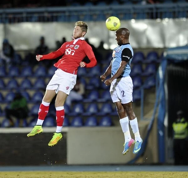 Bristol City's Wes Burns Battles for the Header in Botswana Tour Match
