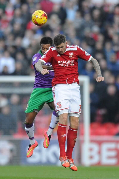 Korey Smith vs Ben Gladwin: Intense Header Battle in Swindon Town vs Bristol City Football Match