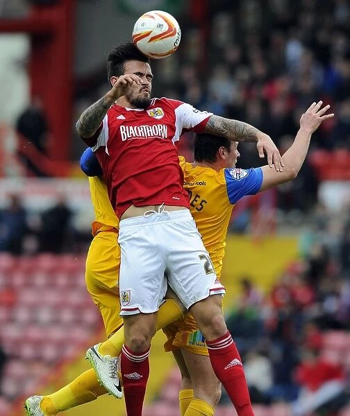 Maron Pack Fights for High Ball in Intense Bristol City vs Preston North End Football Match