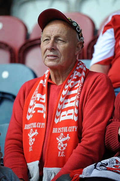 Unwavering Support: A Bristol City Fan Amidst the Action at Rochdale vs. Bristol City (Sky Bet League One, August 2014)
