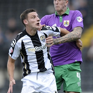 Aden Flint vs Jake Cassidy: Intense Header Battle in Notts County vs Bristol City Football Match, August 2014