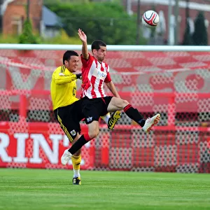 Bristol City Goalkeeper, Stephen Henderson clears the ball under pressure