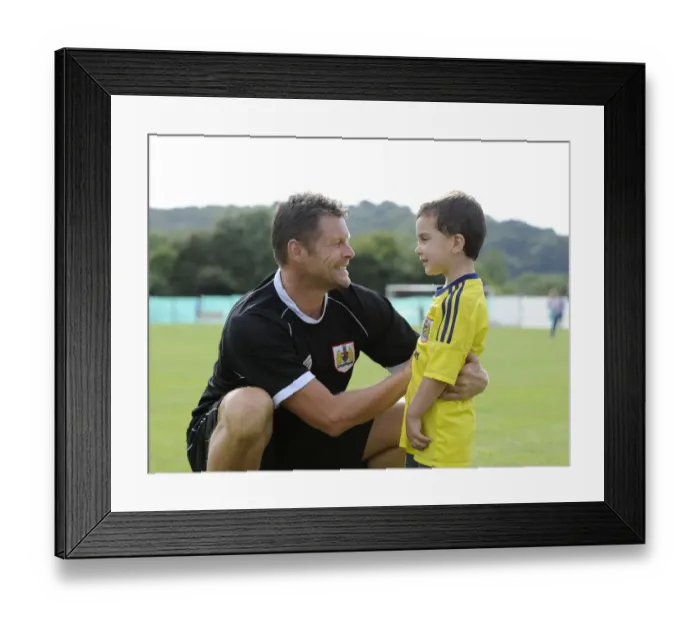 Framed Print : Steve Cotterill Engages with Young Fan at Portishead Town vs. Bristol City Match Framed Print : Steve Cotterill Engages with Young Fan at Portishead Town vs. Bristol City Match