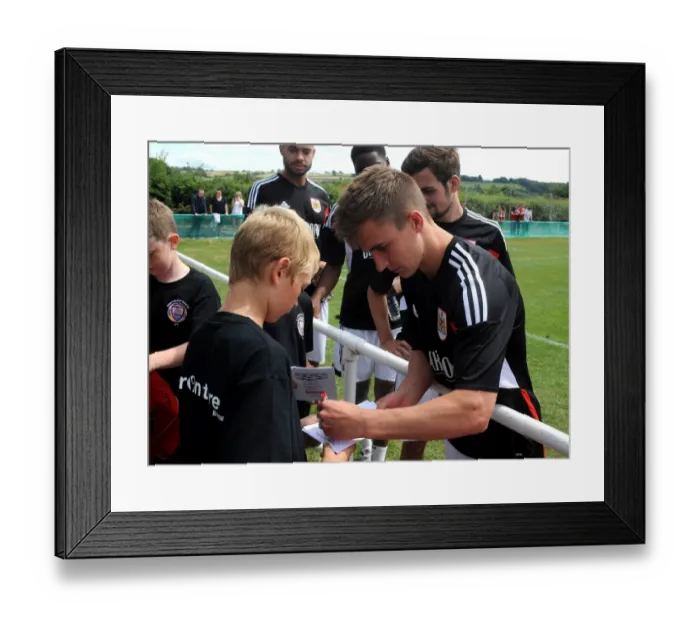 Framed Print : Bristol City's Joe Bryan Connects with Young Fan at Portishead Town Pre-Season Friendly Framed Print : Bristol City's Joe Bryan Connects with Young Fan at Portishead Town Pre-Season Friendly