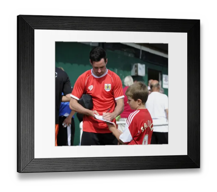 Framed Print : Bristol City's Greg Cunningham Connects with a Young Fan at Portishead Town Pre-Season Friendly Framed Print : Bristol City's Greg Cunningham Connects with a Young Fan at Portishead Town Pre-Season Friendly