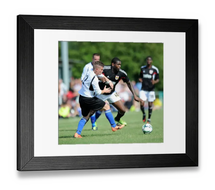 Framed Print : Jay Emmanuel-Thomas vs James Hughes: Intense Moment from Portishead Town vs Bristol City Pre-Season Friendly