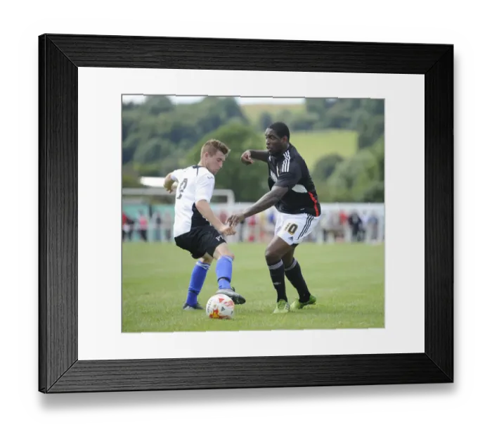 Framed Print : Jay Emmanuel-Thomas of Bristol City Passes by Portishead's Danny Benn - Pre-Season Friendly, 2014