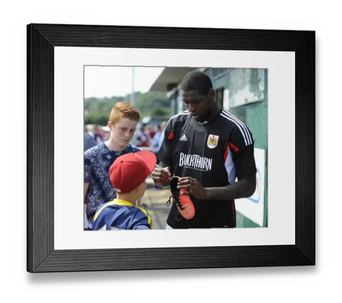 Framed Print : Jay Emmanuel-Thomas Signs Boot at Portishead Town's The Playing Fields During Pre-Season Friendly Against Bristol City Framed Print : Jay Emmanuel-Thomas Signs Boot at Portishead Town's The Playing Fields During Pre-Season Friendly Against Bristol City