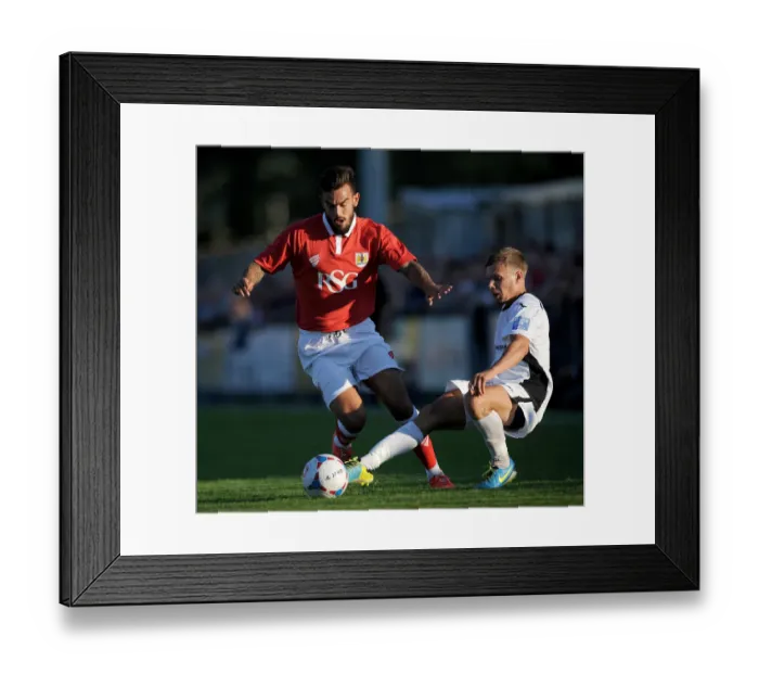 Framed Print : Maron Pack vs Joe McClennan: Intense Moment in Pre-Season Friendly between Weston-super-Mare and Bristol City