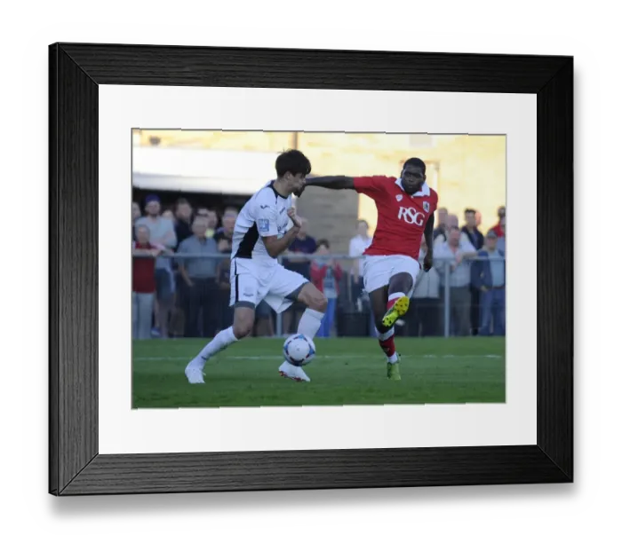Framed Print : Bristol City's Jay Emmanuel-Thomas Goes for Glory in Pre-Season Friendly against Weston Super Mare