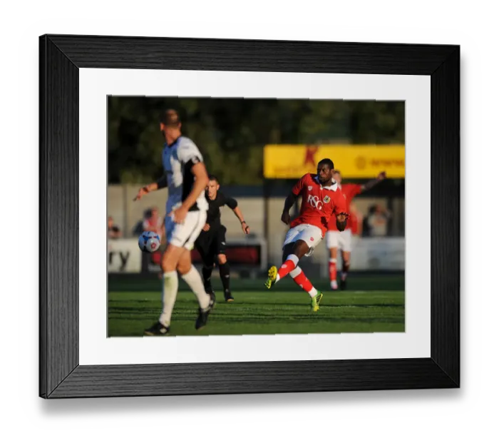Framed Print : Bristol City's Jay Emmanuel-Thomas: Pursuing Victory - Pre-Season Goal Attempt at Woodspring Stadium (2014) Framed Print : Bristol City's Jay Emmanuel-Thomas: Pursuing Victory - Pre-Season Goal Attempt at Woodspring Stadium (2014)