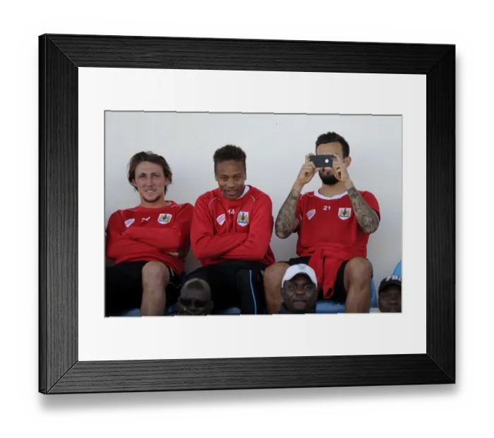 Framed Print : Bristol City Players Bobby Reid, Luke Ayling, and Marlon Pack Watching Extension Gunners vs. Bristol City Match in Gaborone, 2014