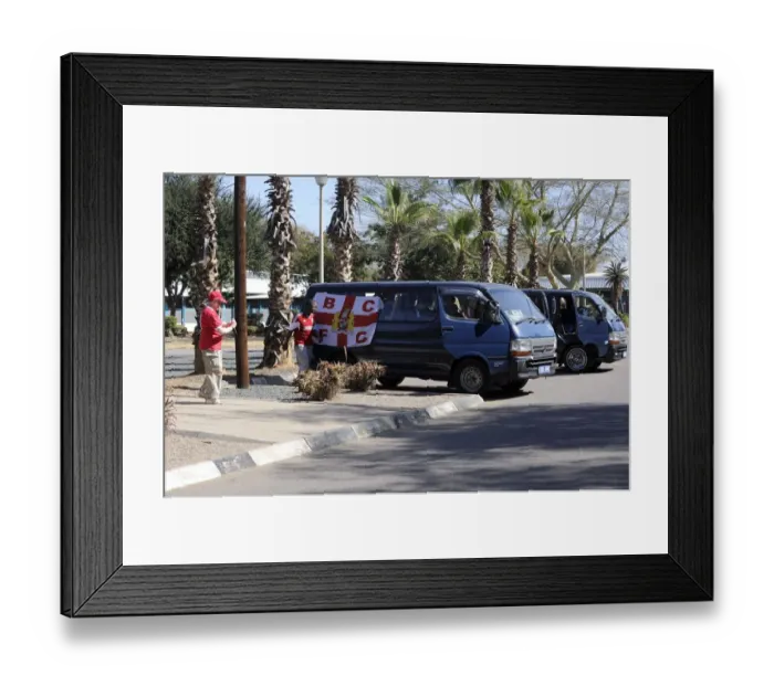 Framed Print : Bristol City Fans Transporting Team Flag to Botswana Stadium for Extension Gunners Match