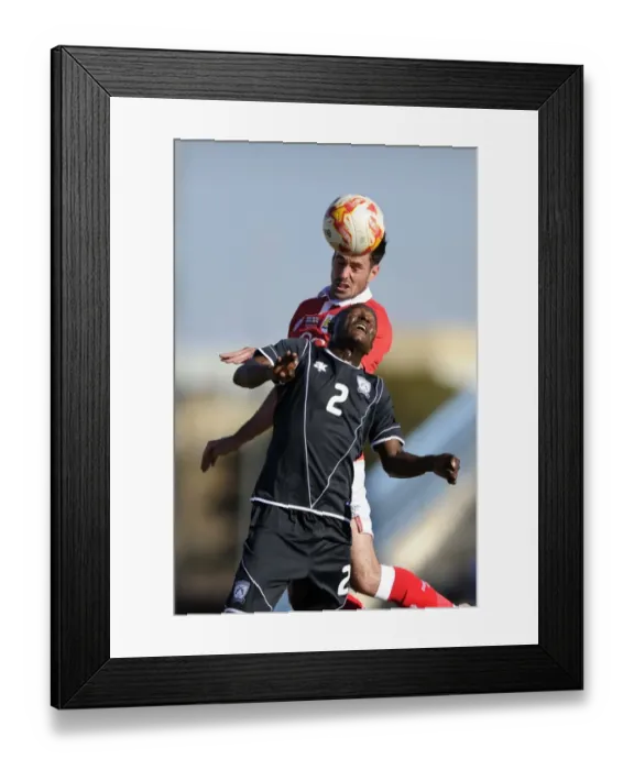 Framed Print : Bristol City's Greg Cunningham vs Extension Gunners Isaac Paete: A Heading Battle in Botswana, 2014 Framed Print : Bristol City's Greg Cunningham vs Extension Gunners Isaac Paete: A Heading Battle in Botswana, 2014