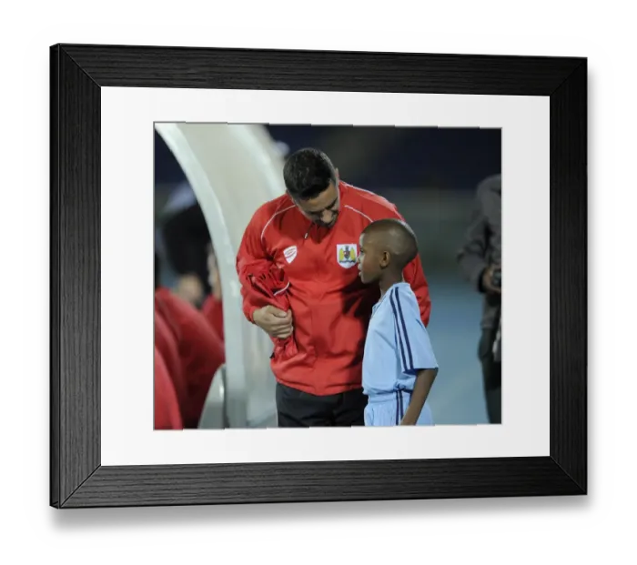 Framed Print : Scott Murray of Bristol City Interacts with a Ball Boy during Botswana Tour Training Session Framed Print : Scott Murray of Bristol City Interacts with a Ball Boy during Botswana Tour Training Session