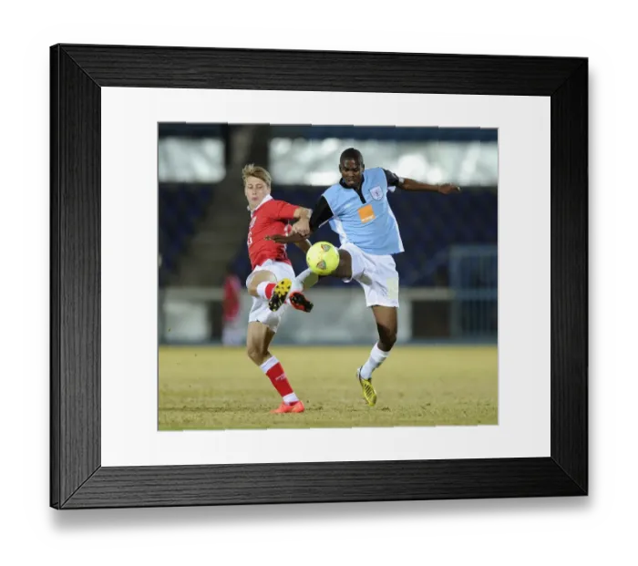 Framed Print : Bristol City's Luke Freeman Faces Off Against Mosha Gaolaolwe of Botswana in Pre-Season Friendly Framed Print : Bristol City's Luke Freeman Faces Off Against Mosha Gaolaolwe of Botswana in Pre-Season Friendly