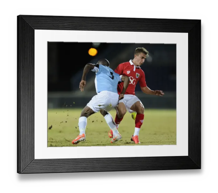 Framed Print : Bristol City's Joe Bryan Fights for the Ball in Botswana Tour Match against Botswana, 2014