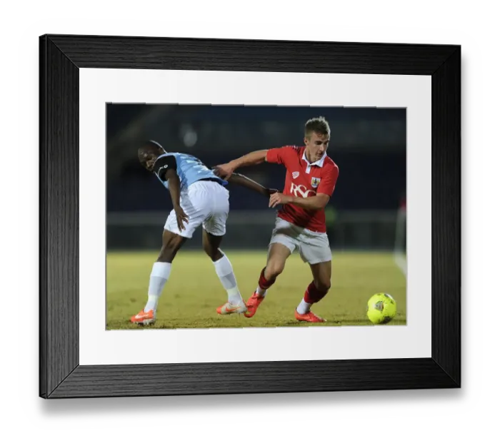 Framed Print : Bristol City's Joe Bryan Fights for Possession in 2014 Botswana Tour Match