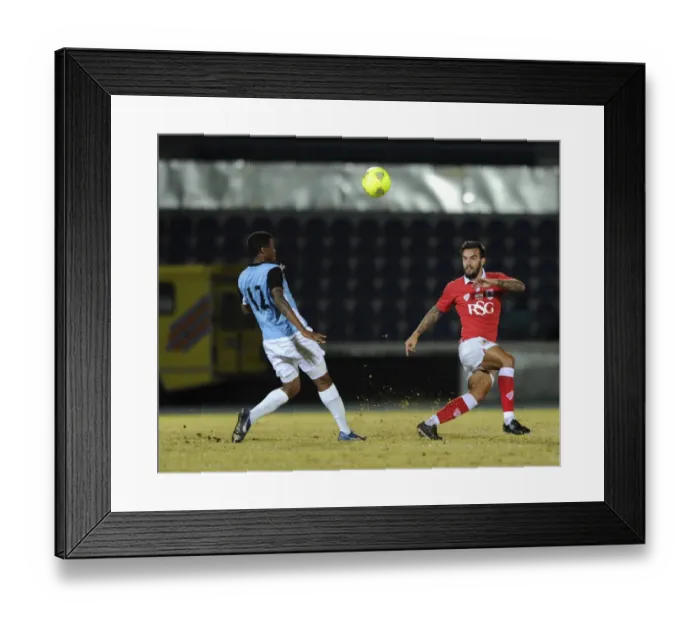 Framed Print : Marlon Pack Under Pressure: Passing the Ball for Bristol City against Botswana, 2014