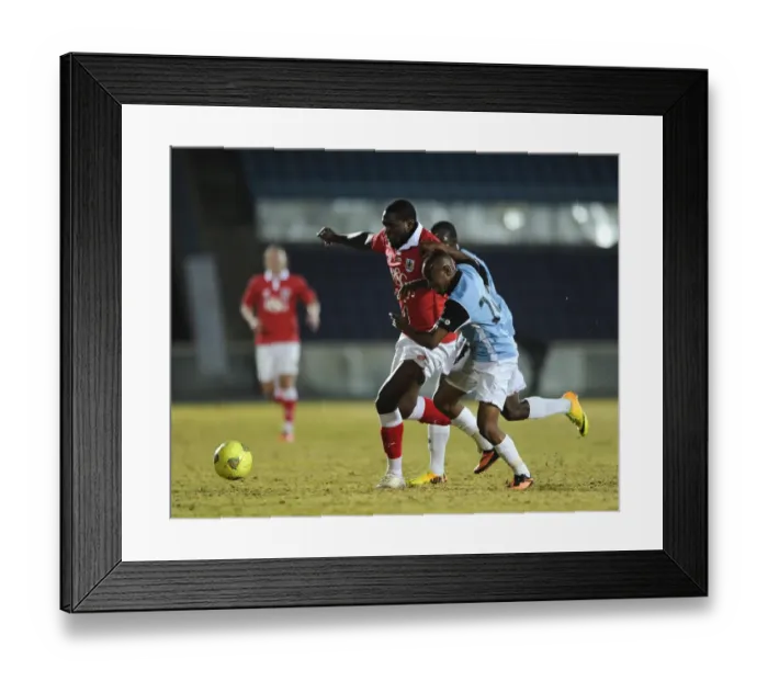 Framed Print : Jay Emmanuel-Thomas Faces Off in Botswana: Bristol City vs. Botswana Football Clash