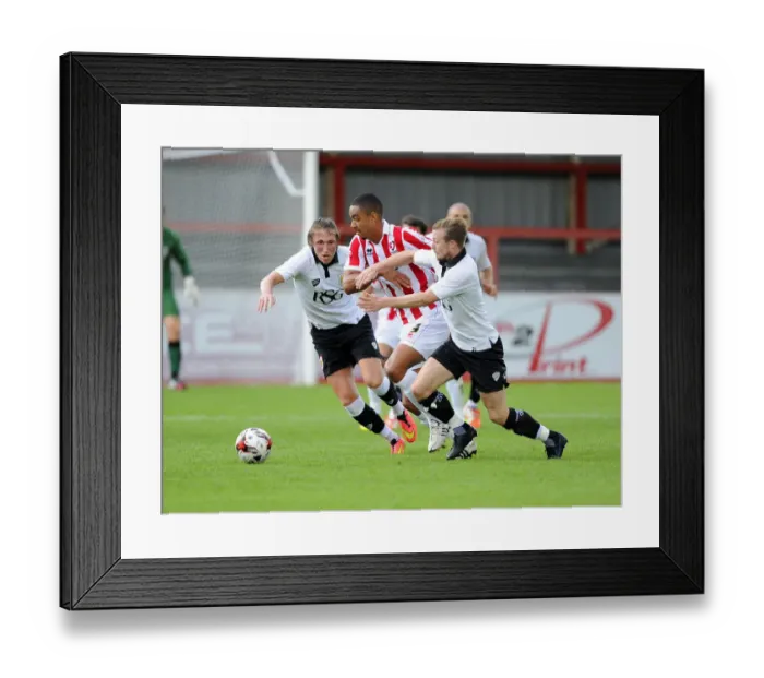 Framed Print : Bristol City Footballers Wade Elliott and Luke Ayling Clash with Cheltenham Town's Byron Harrison in Pre-Season Friendly