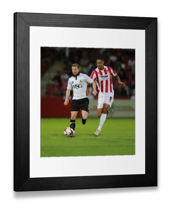 Framed Print : Battling for Supremacy: Wade Elliott vs. Byron Harrison in Cheltenham Town vs. Bristol City Football Match, 2014 Framed Print : Battling for Supremacy: Wade Elliott vs. Byron Harrison in Cheltenham Town vs. Bristol City Football Match, 2014