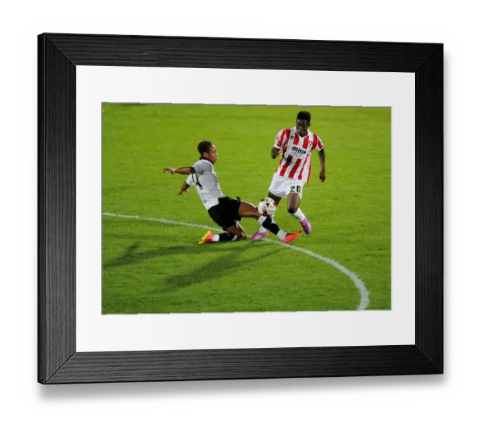 Framed Print : Bobby Reid Tackles Koby Arthur in Pre-Season Clash between Cheltenham Town and Bristol City Framed Print : Bobby Reid Tackles Koby Arthur in Pre-Season Clash between Cheltenham Town and Bristol City