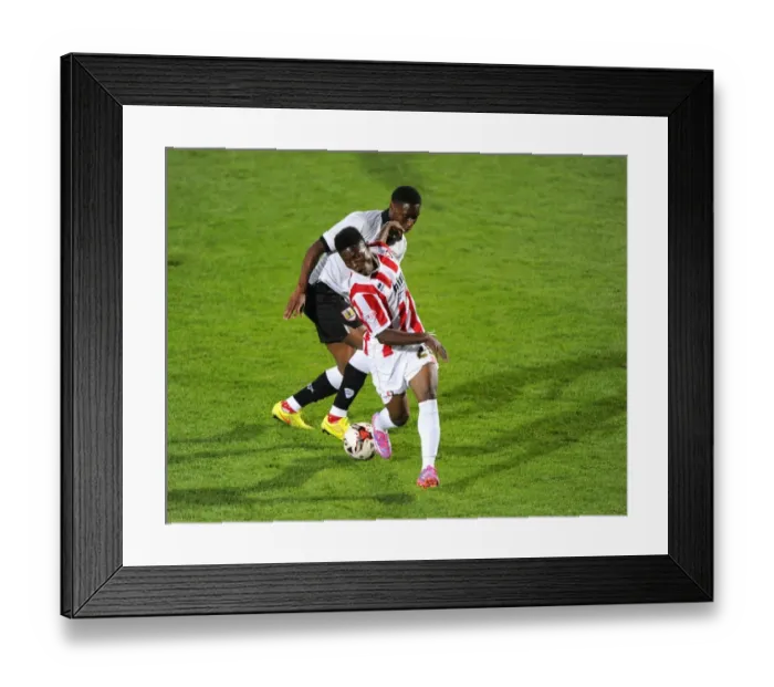 Framed Print : Bristol City's Jordan Wynter vs. Koby Arthur in Intense Battle during Cheltenham Town vs. Bristol City Pre-Season Friendly Framed Print : Bristol City's Jordan Wynter vs. Koby Arthur in Intense Battle during Cheltenham Town vs. Bristol City Pre-Season Friendly