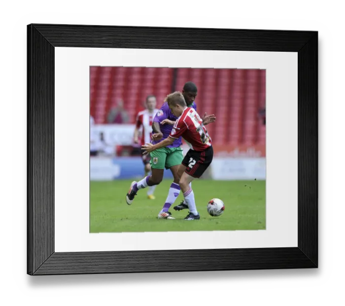 Framed Print : Clash of Forces: Mark Little vs. Louis Reed in Sky Bet League One Opener at Bramal Lane Framed Print : Clash of Forces: Mark Little vs. Louis Reed in Sky Bet League One Opener at Bramal Lane