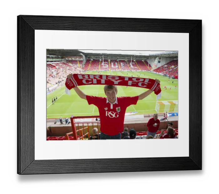 Framed Print : Bristol City Fan Cheers at Sheffield United's Bramal Lane in League One Opener Framed Print : Bristol City Fan Cheers at Sheffield United's Bramal Lane in League One Opener