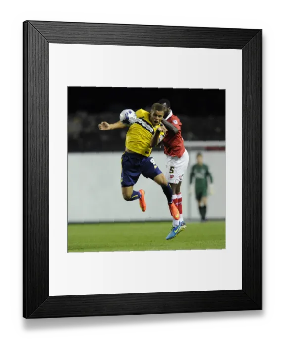 Framed Print : Bristol City vs Oxford United: Carlton Morris Outmuscles Derrick Williams for the Ball Framed Print : Bristol City vs Oxford United: Carlton Morris Outmuscles Derrick Williams for the Ball