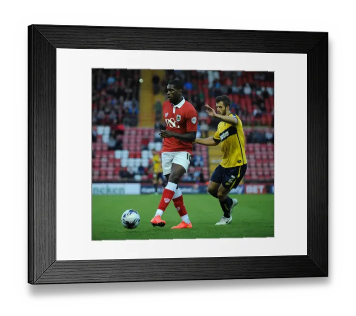 Framed Print : Bristol City's Jay Emmanuel-Thomas Faces Off Against Oxford United's Jonathan Meades in Capital One Cup Clash Framed Print : Bristol City's Jay Emmanuel-Thomas Faces Off Against Oxford United's Jonathan Meades in Capital One Cup Clash