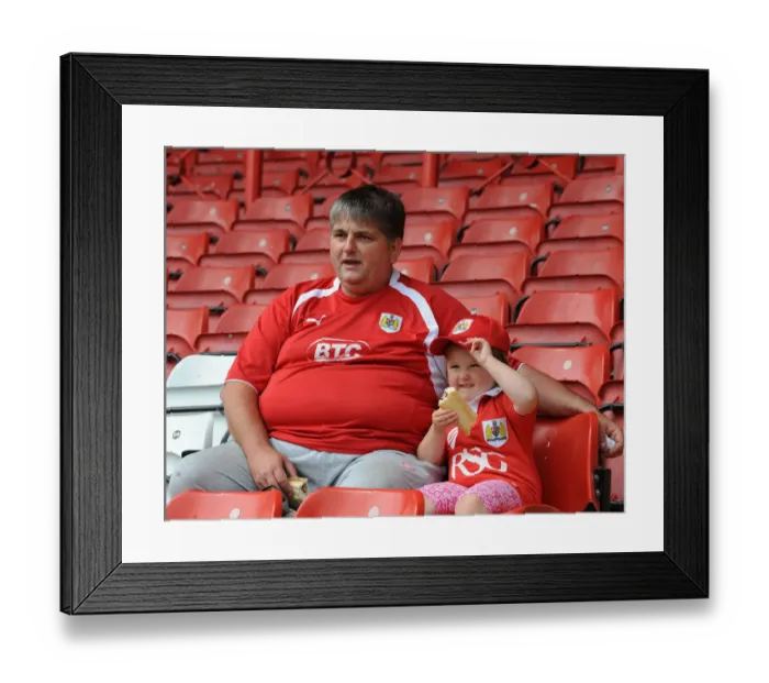 Framed Print : Bristol City Fans Watch Intently as the Action Unfolds at Ashton Gate