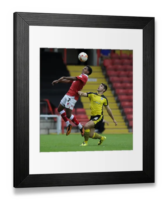Framed Print : Korey Smith Takes Flight: Aerial Battle in Bristol City vs Colchester United