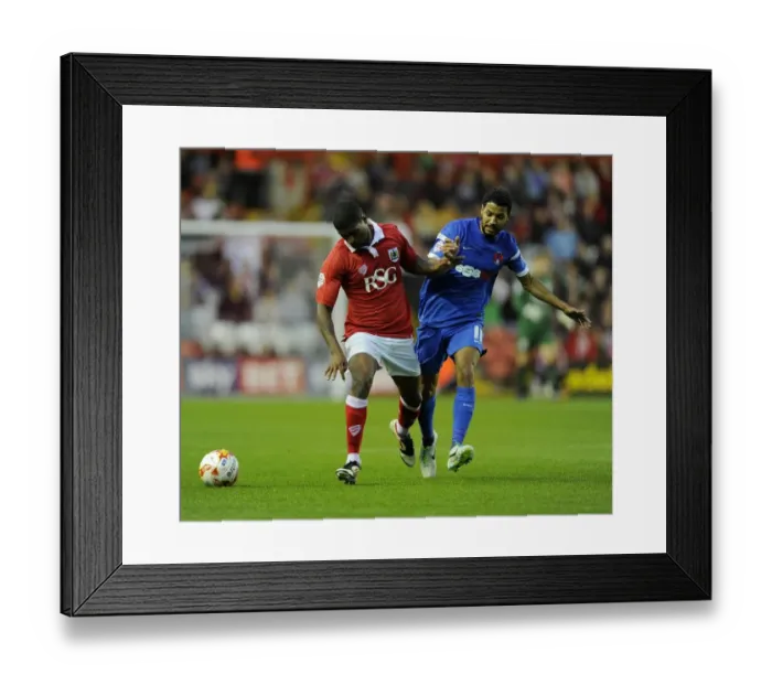 Framed Print : Battling for Supremacy: Mark Little vs. Jobi McAnuff in the 2014 Bristol City vs. Leyton Orient Clash