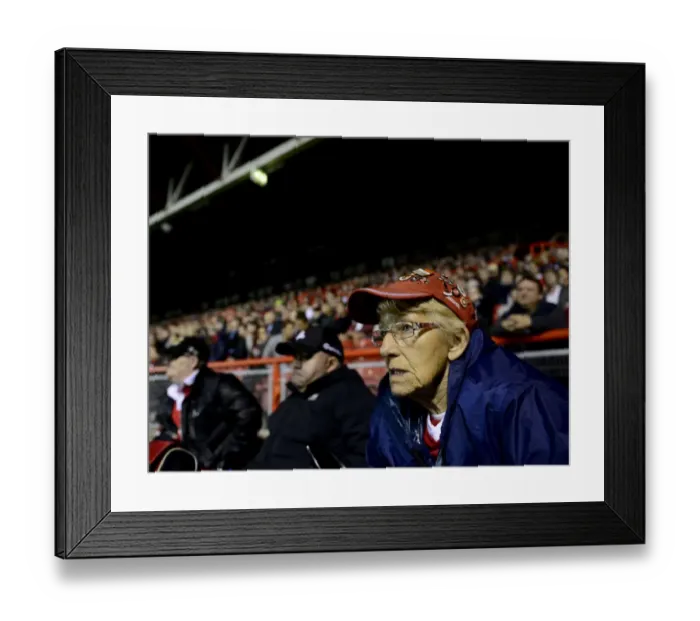 Framed Print : A Bristol City Fan Intently Watches the Action Unfold at Ashton Gate Framed Print : A Bristol City Fan Intently Watches the Action Unfold at Ashton Gate