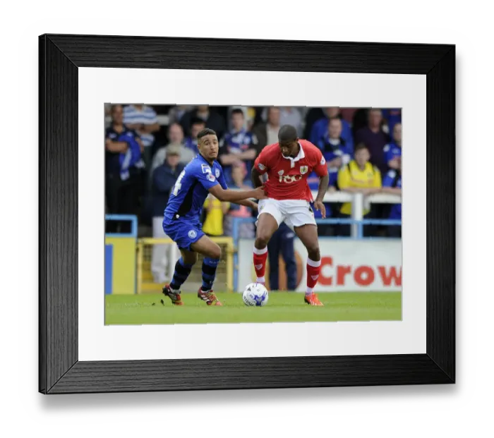 Framed Print : Mark Little vs Bastien Hery: Intense Moment from Rochdale vs Bristol City Football Match, August 2014