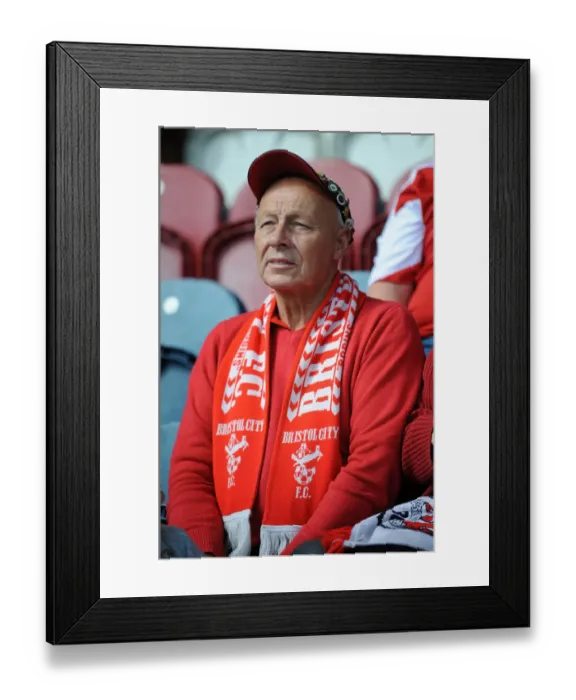Framed Print : Unwavering Support: A Bristol City Fan Amidst the Action at Rochdale vs. Bristol City (Sky Bet League One, August 2014)