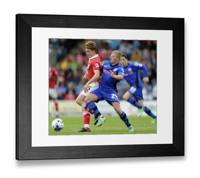 Framed Print : Bristol City's Luke Freeman Faces Off Against Rochdale's Jamie Allen in Sky Bet League One Clash Framed Print : Bristol City's Luke Freeman Faces Off Against Rochdale's Jamie Allen in Sky Bet League One Clash