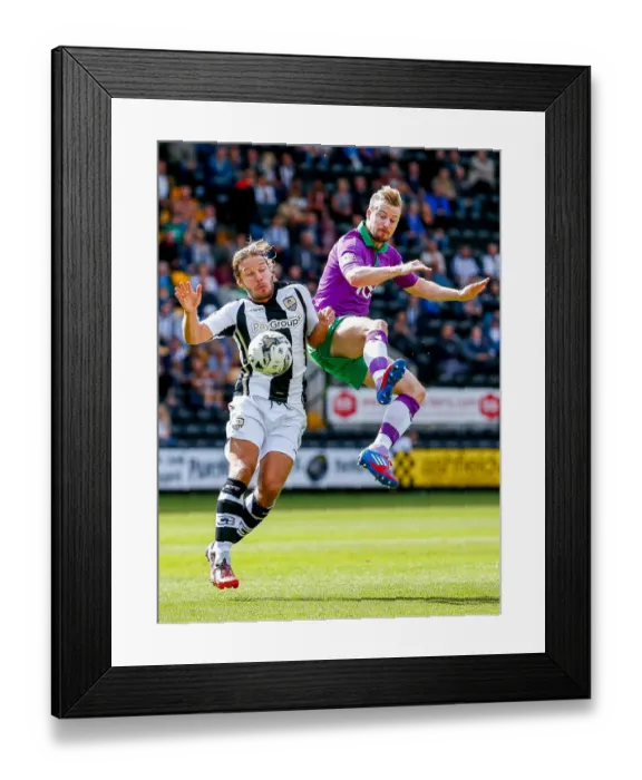 Framed Print : Competing in the Air: Smith vs. Elliott in Notts County vs. Bristol City Football Match, 2014
