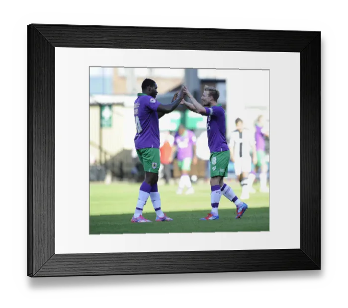 Framed Print : Last-Minute Drama: Elliott and Emmanuel-Thomas Celebrate Thrilling Win for Bristol City over Notts County