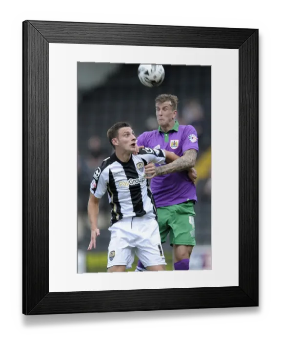 Framed Print : Aden Flint vs Jake Cassidy: Intense Header Battle in Notts County vs Bristol City Football Match, August 2014