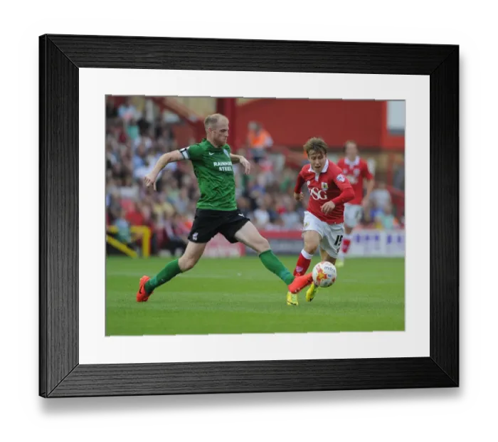 Framed Print : Battling for Supremacy: Luke Freeman vs Neil Bishop in Bristol City vs Scunthorpe United Football Match, September 6, 2014